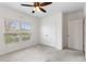 Bright bedroom with a large window, closet, neutral carpet, and a ceiling fan, offering a comfortable space at 1504 Finchburg St, Minneola, FL 34715
