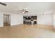 Open floor plan features a spacious living room connected to the modern kitchen, perfect for entertaining at 1504 Finchburg St, Minneola, FL 34715