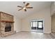 Living area with brick fireplace and access to screened porch at 1904 Houndslake Dr, Winter Park, FL 32792