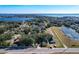 Aerial view of a home on a lake with lush green landscape at 1968 Berkley Rd, Auburndale, FL 33823
