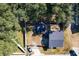 Aerial view showing house, backyard, and trees at 1968 Berkley Rd, Auburndale, FL 33823