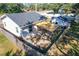 Aerial view showing house, backyard, and shade sail at 1968 Berkley Rd, Auburndale, FL 33823