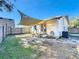 Backyard with patio, shade sail, and wooden fence at 1968 Berkley Rd, Auburndale, FL 33823