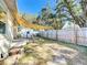 Large backyard with shade sail and wooden fence at 1968 Berkley Rd, Auburndale, FL 33823