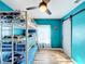 ' bedroom with a teal color, bunk beds, and ceiling fan at 1968 Berkley Rd, Auburndale, FL 33823