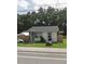 Single-story home with a well-maintained lawn and wood fence at 1968 Berkley Rd, Auburndale, FL 33823