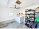 Laundry room with washer, dryer, and storage shelving at 1968 Berkley Rd, Auburndale, FL 33823