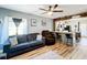 Open concept living room featuring hardwood floors and kitchen at 1968 Berkley Rd, Auburndale, FL 33823
