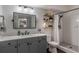 Modern bathroom with gray vanity, subway tile, and a shower at 206 E South St # 6031, Orlando, FL 32801