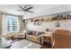Bedroom with crib, sofa, and plenty of storage at 206 E South St # 6031, Orlando, FL 32801