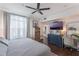 King-size bed, large TV, and walk-in closet in this main bedroom at 206 E South St # 6031, Orlando, FL 32801