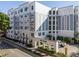 Modern building exterior with parking and landscaping at 206 E South St # 6031, Orlando, FL 32801