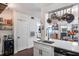 Modern white kitchen with stainless steel appliances and breakfast bar at 206 E South St # 6031, Orlando, FL 32801