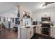 Modern white kitchen with stainless steel appliances and breakfast bar at 206 E South St # 6031, Orlando, FL 32801