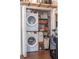 Stackable washer and dryer with extra storage in closet at 206 E South St # 6031, Orlando, FL 32801