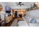 Spacious living room with hardwood floors and a large TV at 206 E South St # 6031, Orlando, FL 32801
