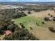 Aerial view of property showing home, expansive pastures, and surrounding landscape at 2850 Horton Rd, Kissimmee, FL 34744