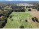 Aerial view of property showing home, expansive pastures, and surrounding landscape at 2850 Horton Rd, Kissimmee, FL 34744
