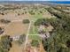 Aerial view of property showing home, expansive pastures, and surrounding landscape at 2850 Horton Rd, Kissimmee, FL 34744