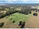 Aerial view of property showing home, expansive pastures, and surrounding landscape at 2850 Horton Rd, Kissimmee, FL 34744