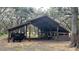 Wooden barn with metal roof providing shelter for livestock at 2850 Horton Rd, Kissimmee, FL 34744