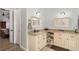 Elegant bathroom with granite countertop, double sinks, and beige cabinets at 2850 Horton Rd, Kissimmee, FL 34744