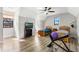 Bright bedroom with two twin beds, a ceiling fan, and wood flooring at 2850 Horton Rd, Kissimmee, FL 34744