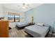Two twin beds in a bedroom with light blue walls and window views at 2850 Horton Rd, Kissimmee, FL 34744
