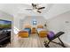 Bright bedroom with two twin beds, a ceiling fan, and wood flooring at 2850 Horton Rd, Kissimmee, FL 34744