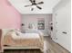 Pretty bedroom with a white sleigh bed, built in desk, and plenty of natural light at 2850 Horton Rd, Kissimmee, FL 34744