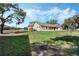 Country home with large yard, detached garage, and mature trees at 2850 Horton Rd, Kissimmee, FL 34744