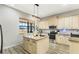 Modern kitchen with granite island, stainless steel appliances & view to dining area at 2850 Horton Rd, Kissimmee, FL 34744