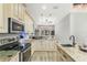 Open concept kitchen with granite countertops and stainless steel appliances at 2850 Horton Rd, Kissimmee, FL 34744