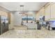 Modern kitchen boasts granite countertops, stainless steel appliances, and an island at 2850 Horton Rd, Kissimmee, FL 34744