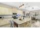 Open concept kitchen with granite island, stainless steel appliances & breakfast bar at 2850 Horton Rd, Kissimmee, FL 34744