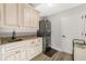 Laundry room with stacked washer and dryer and granite countertop at 2850 Horton Rd, Kissimmee, FL 34744