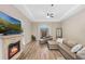 Spacious living room with hardwood floors, fireplace, and sectional sofa at 2850 Horton Rd, Kissimmee, FL 34744