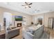 Spacious living room with hardwood floors, fireplace, and sectional sofa at 2850 Horton Rd, Kissimmee, FL 34744
