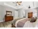 Main bedroom with wood floors, king-size bed and plenty of closet space at 2850 Horton Rd, Kissimmee, FL 34744
