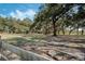 Large pasture with mature oak trees and a wooden fence at 2850 Horton Rd, Kissimmee, FL 34744