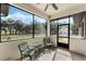 Relaxing screened porch with two chairs and beautiful views of the property at 2850 Horton Rd, Kissimmee, FL 34744