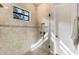 Spacious shower with glass enclosure and neutral tile at 2850 Horton Rd, Kissimmee, FL 34744