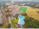 Aerial view of a community with sports fields and Olympic-size swimming pool at 2855 Cady Way, Winter Park, FL 32792