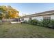 Large backyard with patio, grass, and mature shrubs at 2855 Cady Way, Winter Park, FL 32792