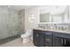 Modern bathroom with double vanity, granite countertop, and walk-in shower at 2855 Cady Way, Winter Park, FL 32792