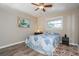Charming bedroom with a comfy bed and a ceiling fan at 2855 Cady Way, Winter Park, FL 32792
