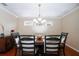 Bright dining area featuring hardwood floors and an elegant chandelier at 2855 Cady Way, Winter Park, FL 32792