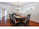 Charming dining room with hardwood floors, oval table, and chandelier at 2855 Cady Way, Winter Park, FL 32792