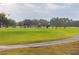 Golf course with players practicing their swings on the driving range at 2855 Cady Way, Winter Park, FL 32792