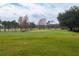 Golf course featuring a lush green fairway and palm trees at 2855 Cady Way, Winter Park, FL 32792